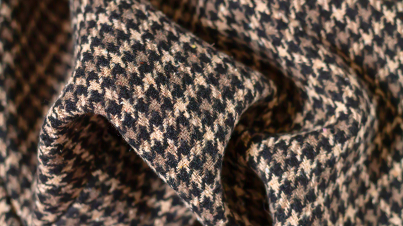 A close-up of a black and white houndstooth fabric