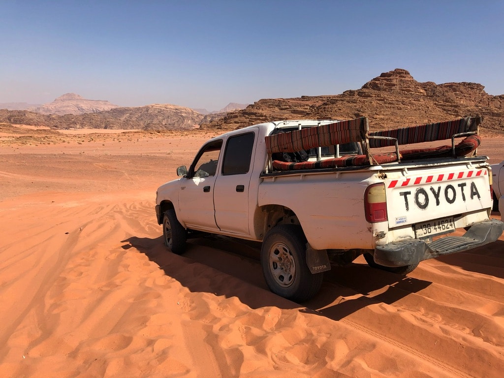 A 4x4 pickup truck in Wadi Rum desert