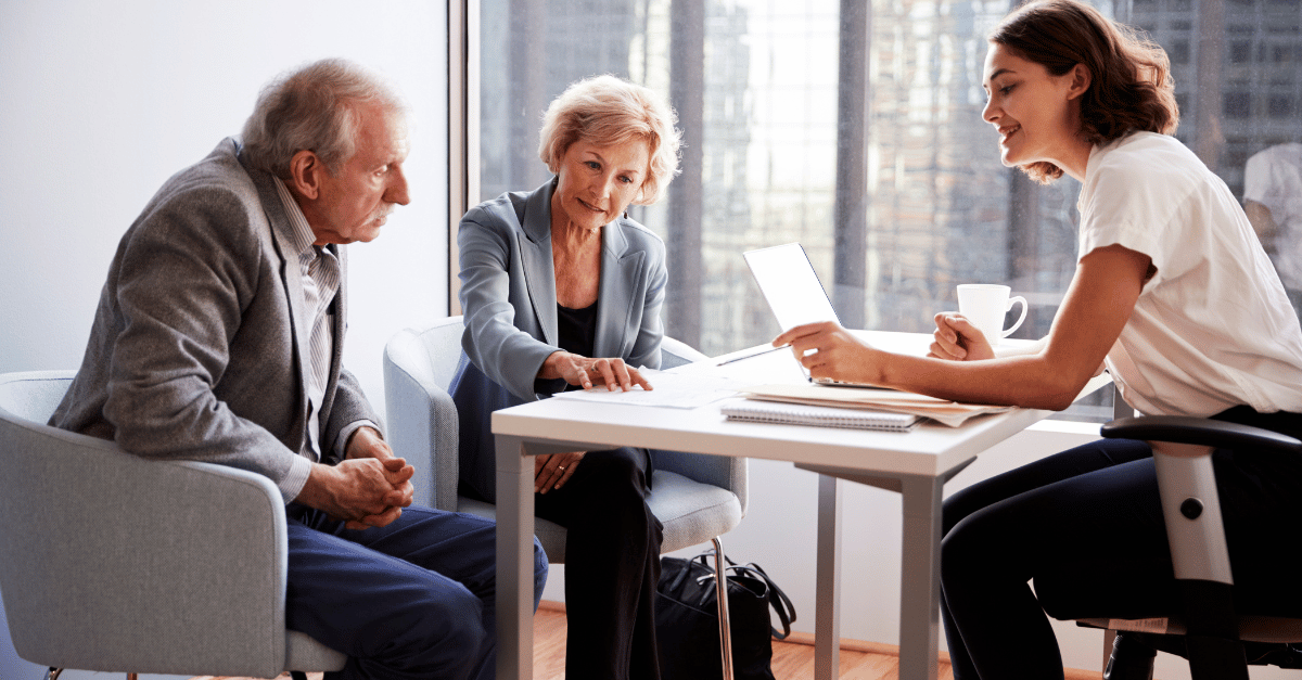 A retiring couple meeting with a financial advisor 