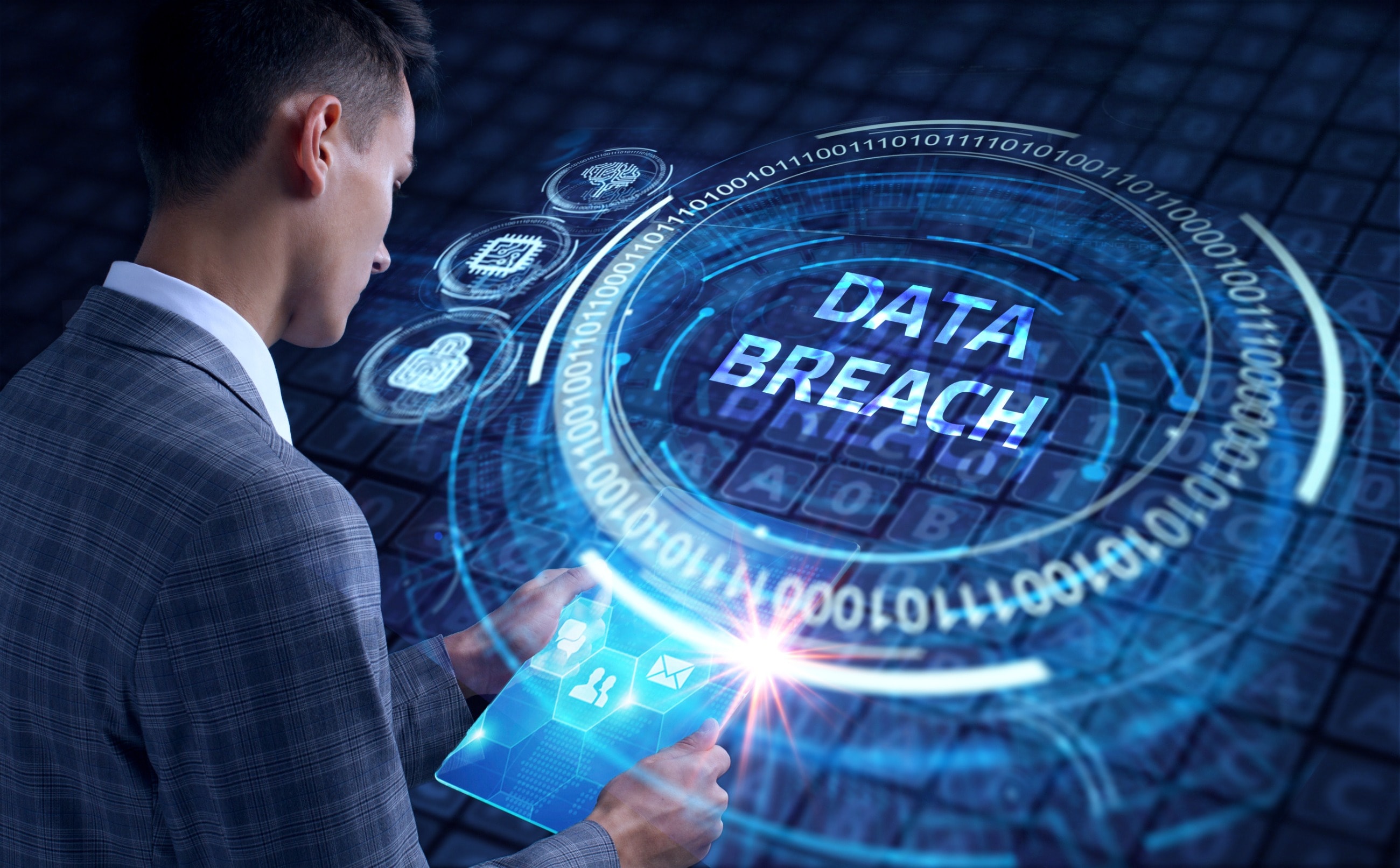 A data breach solicitor stands in front of a blue background 