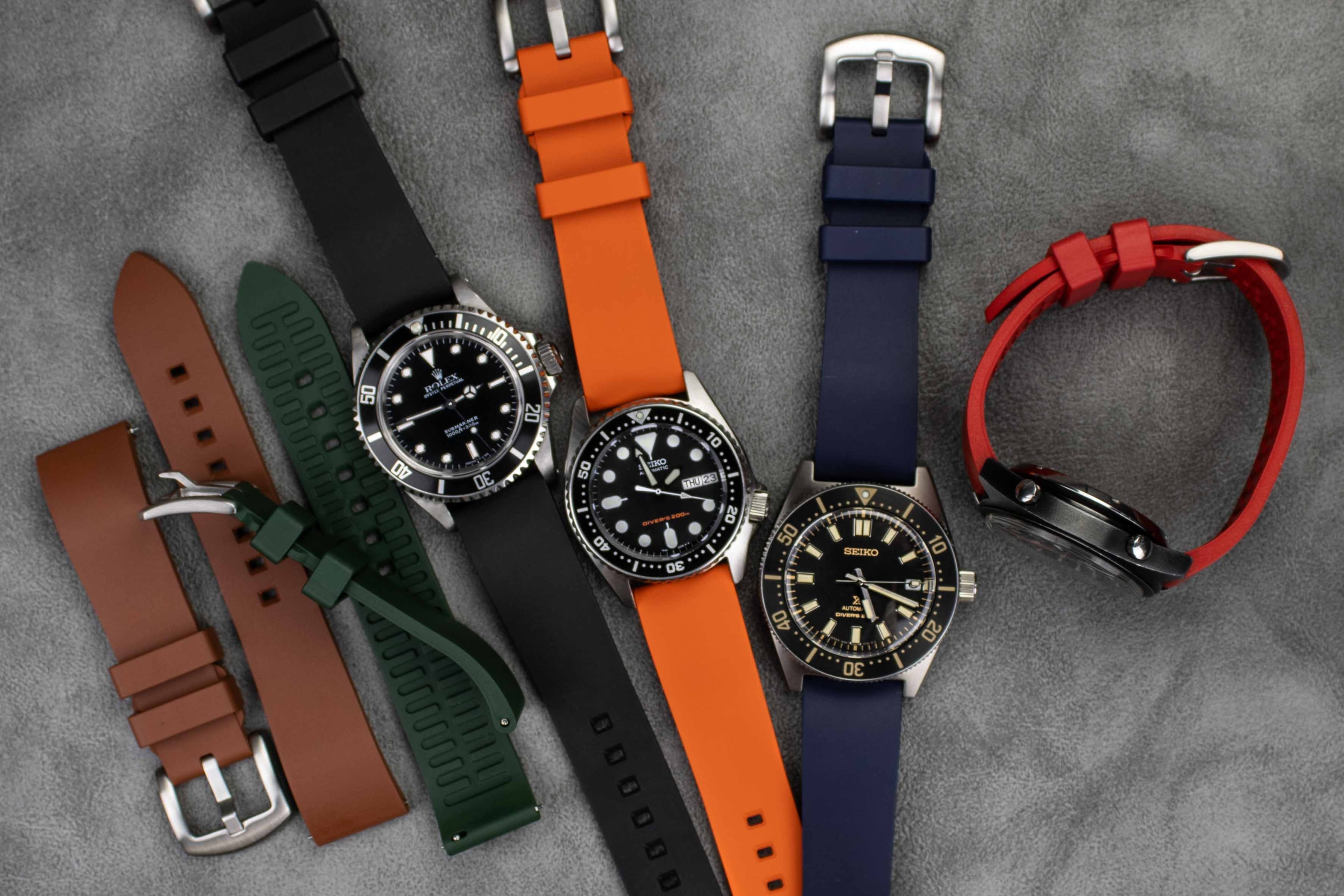 Diverse rubber watch straps in various colors and styles