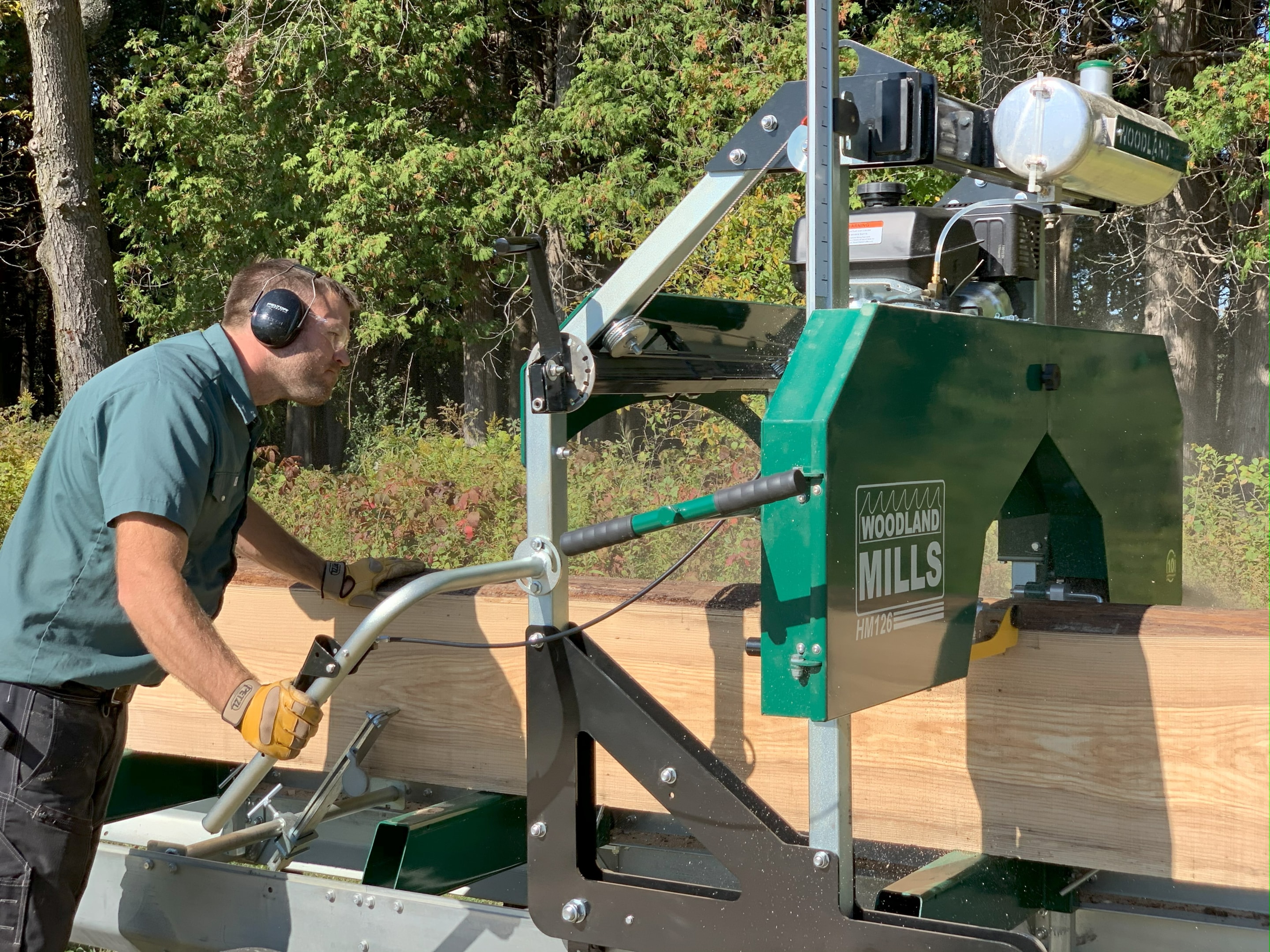 A Woodland Mills HM126 being used to mill up a log.