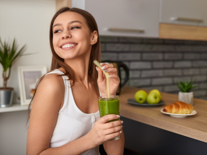 A happy woman in the process of detoxing harmful substances that negatively affect health.