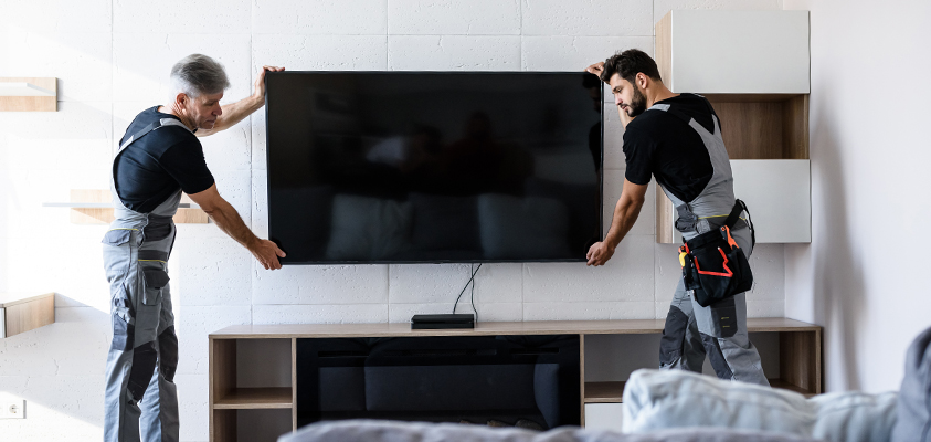 When wall mounting a television, it's best to ask for help from a trusted friend, family member or professional.