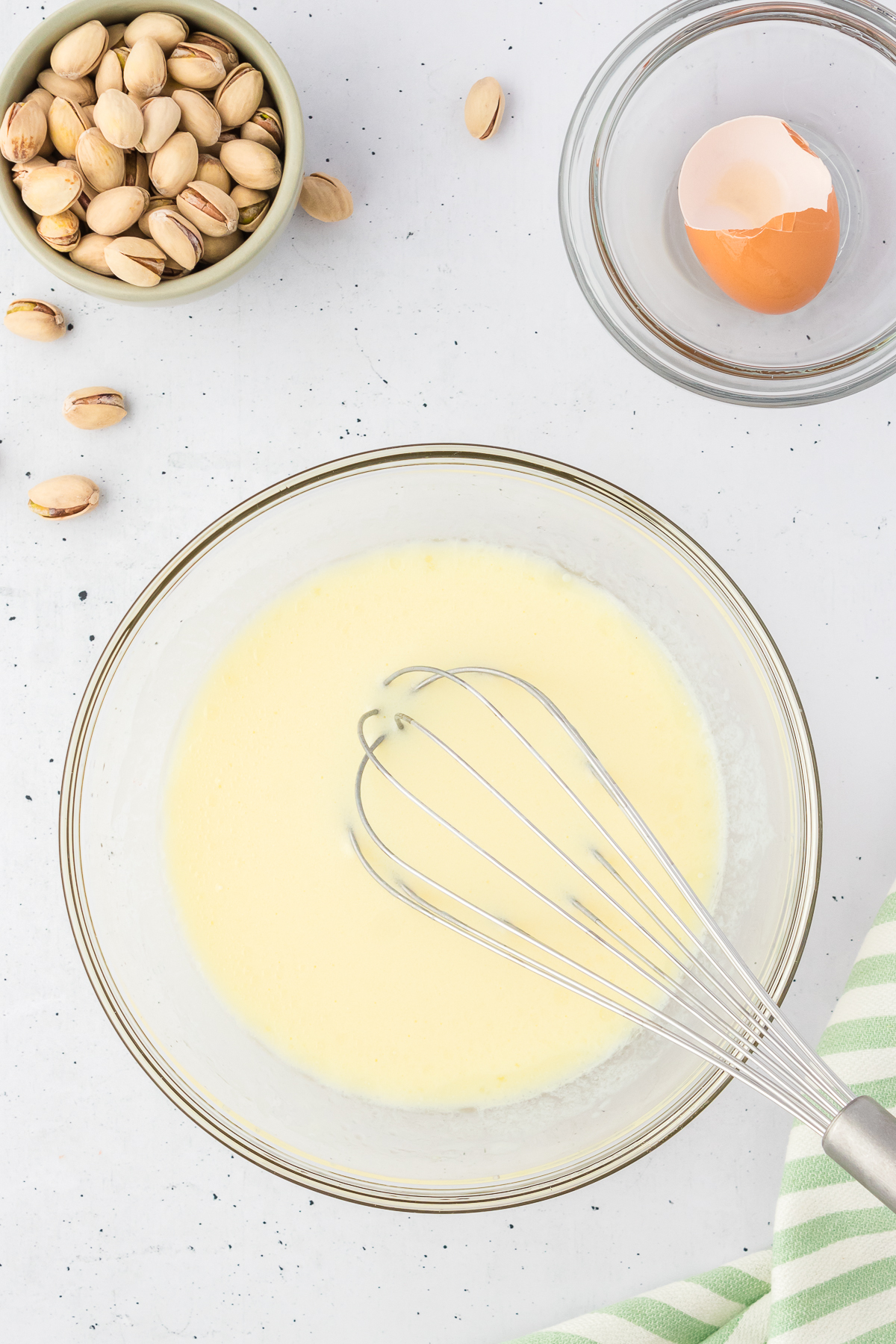 pistachio bread wet ingredients in bowl with whisk