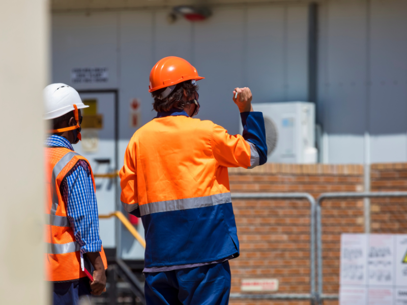 An image showing fence contractors evaluating a project.