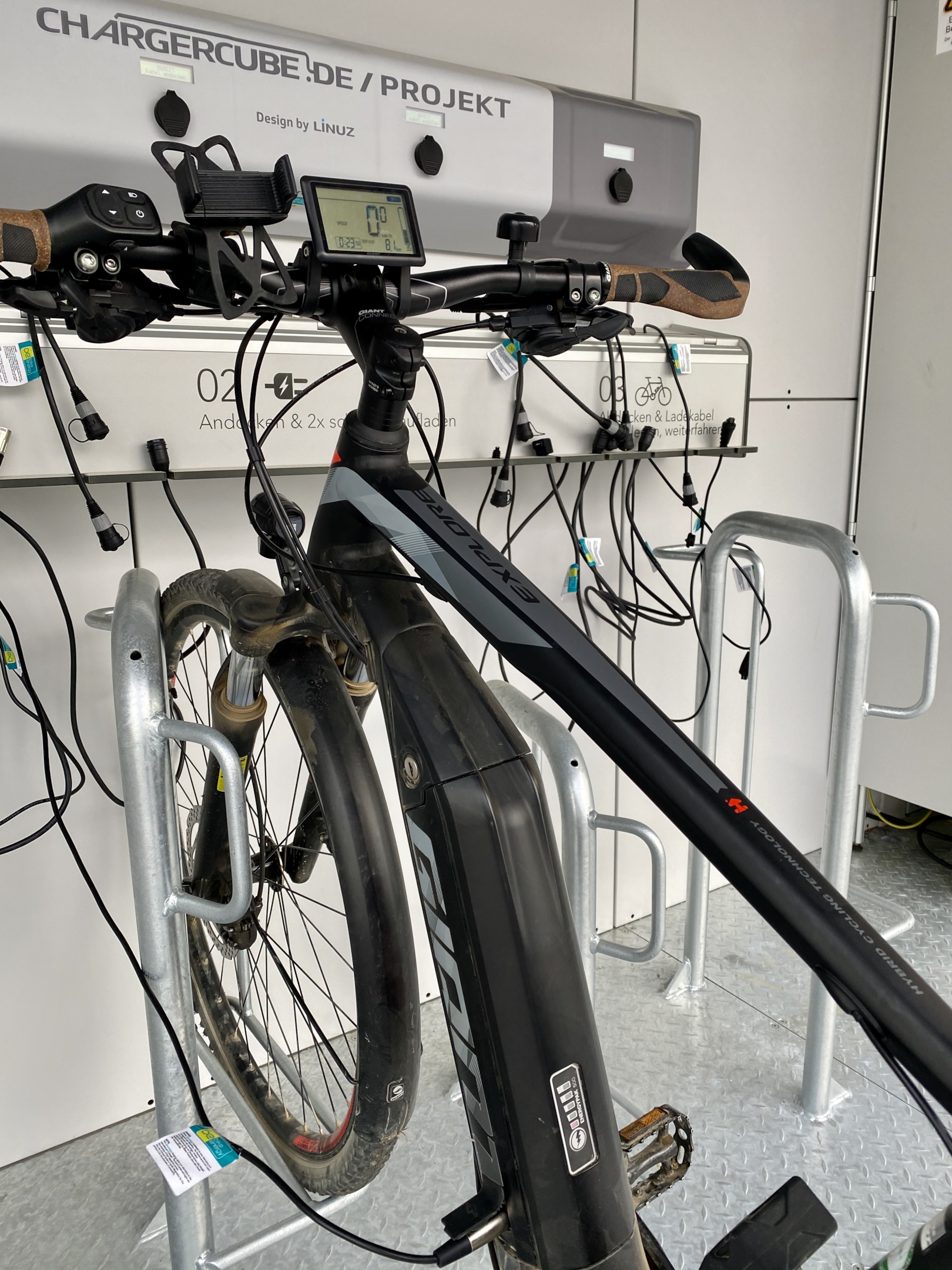 An image showing the ebike charging process with a charger plugged into the bike's battery for efficient charging.
