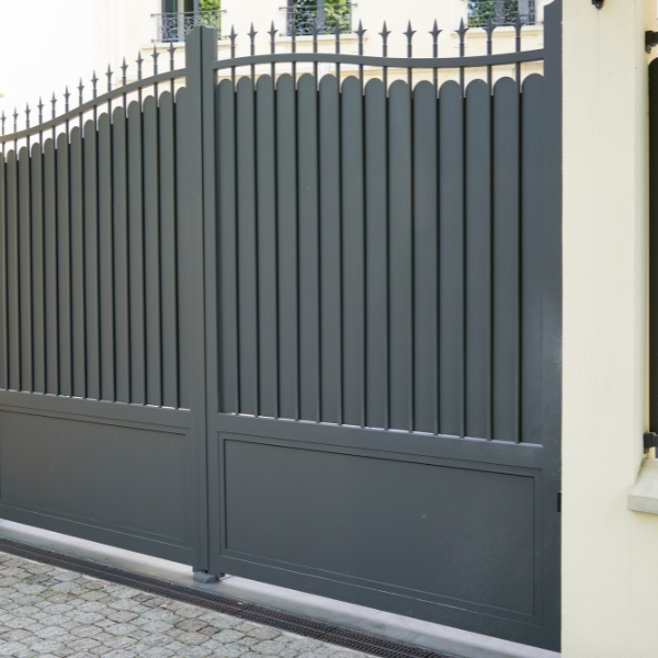 An image showing modern lightweight aluminum gates with a powder-coated finish.