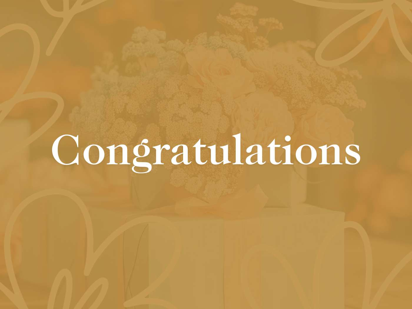 Elegant bouquet of cream roses and baby's breath beautifully arranged on a gift box with a soft golden background, inscribed with 'Congratulations'—Fabulous Flowers and Gifts.