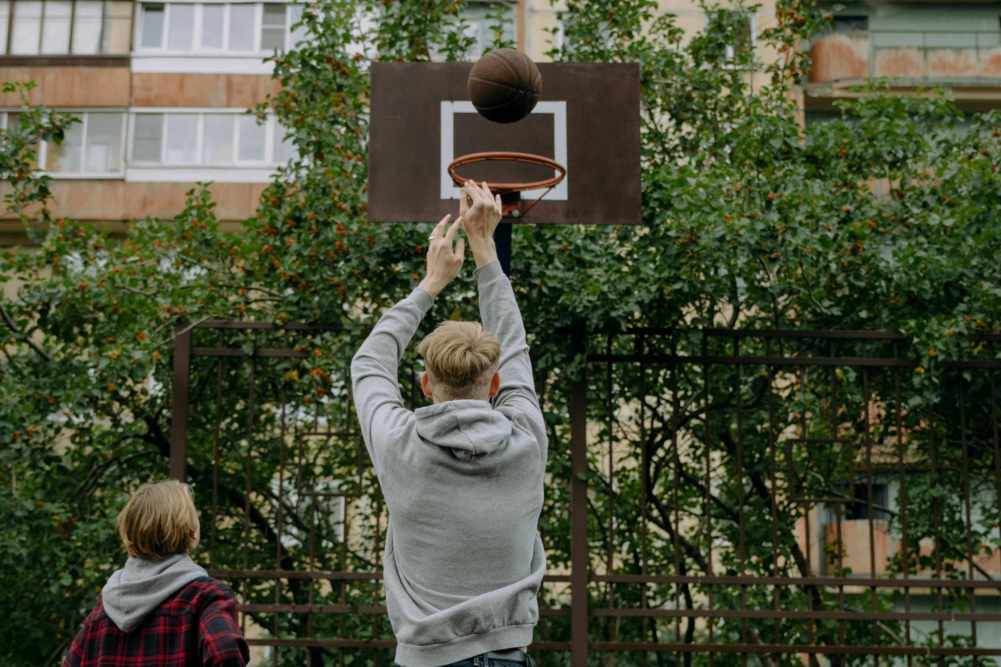 Photo by cottonbro studio: https://www.pexels.com/photo/a-man-in-gray-hoodie-shooting-a-ball-7236368/