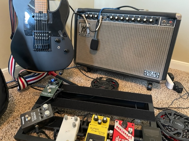 Music Man Amplifier with Distortion Pedals and Charvel