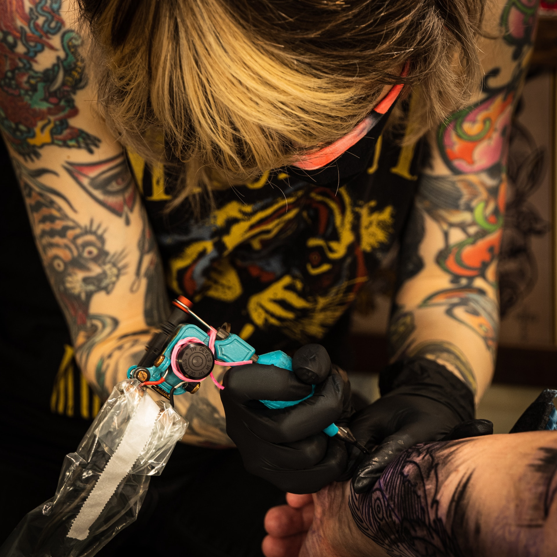 An Experienced Artist working on a New Tattoo