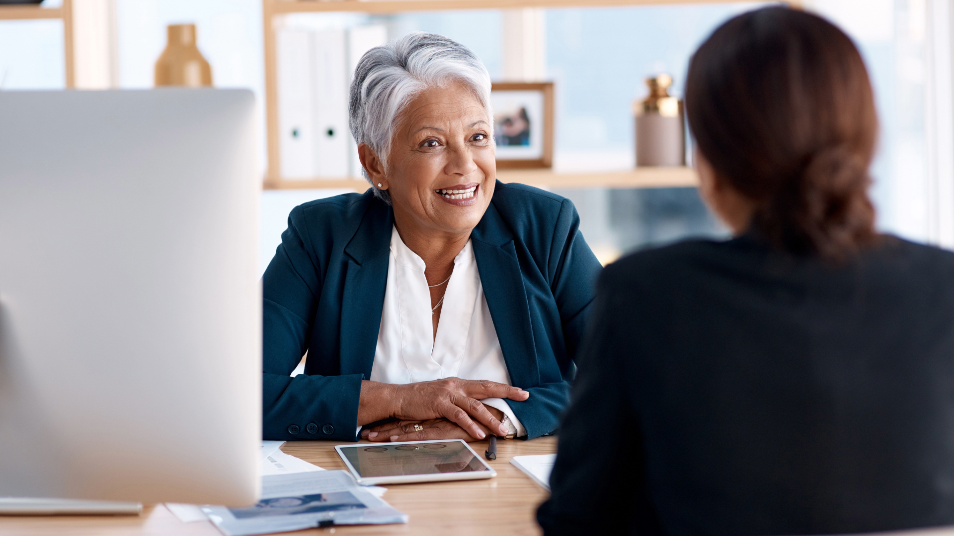 A business professional interviewing or surveying customers for feedback.