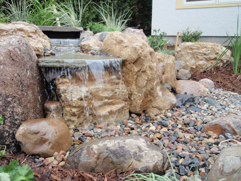 Enhance your backyard with a pondless waterfall l MODLUST