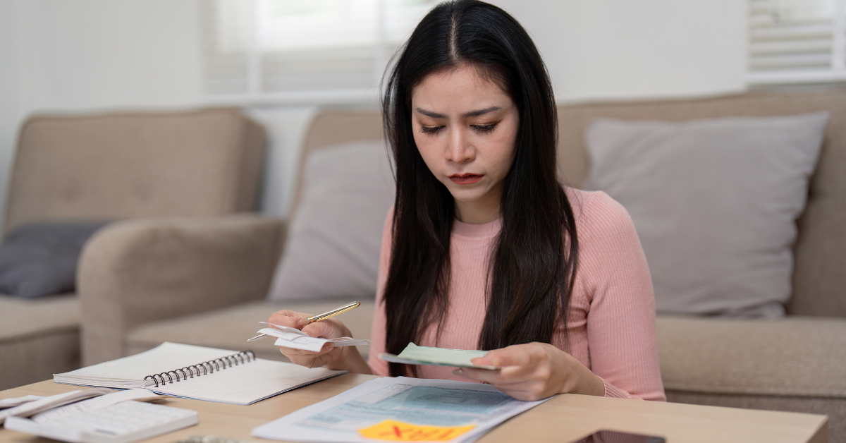 Female OnlyFans creator reviewing documents and learning what happens if you overpay taxes.