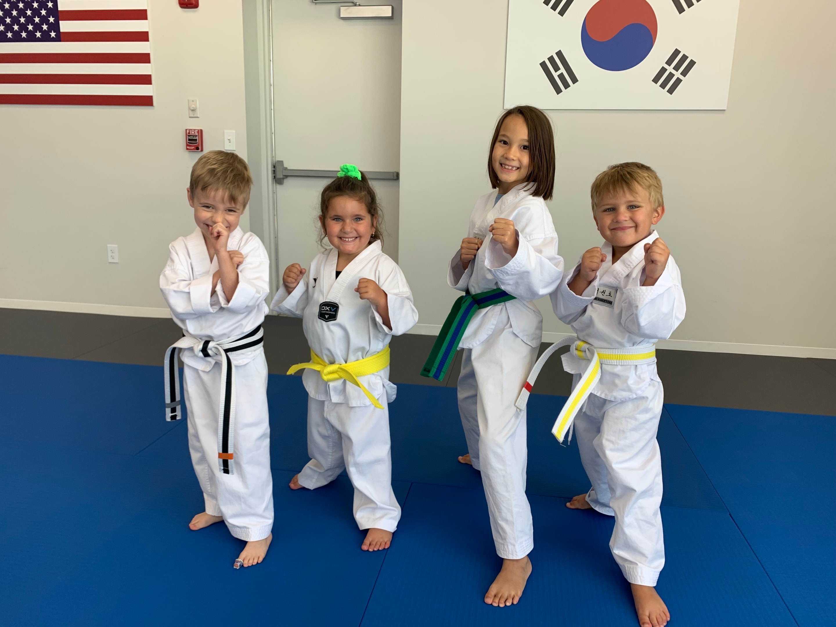 Preschool children practicing Taekwondo techniques experience the benefits of Taekwondo, learning discipline and other aspects of growth while understanding that failure is part of a student's progress.