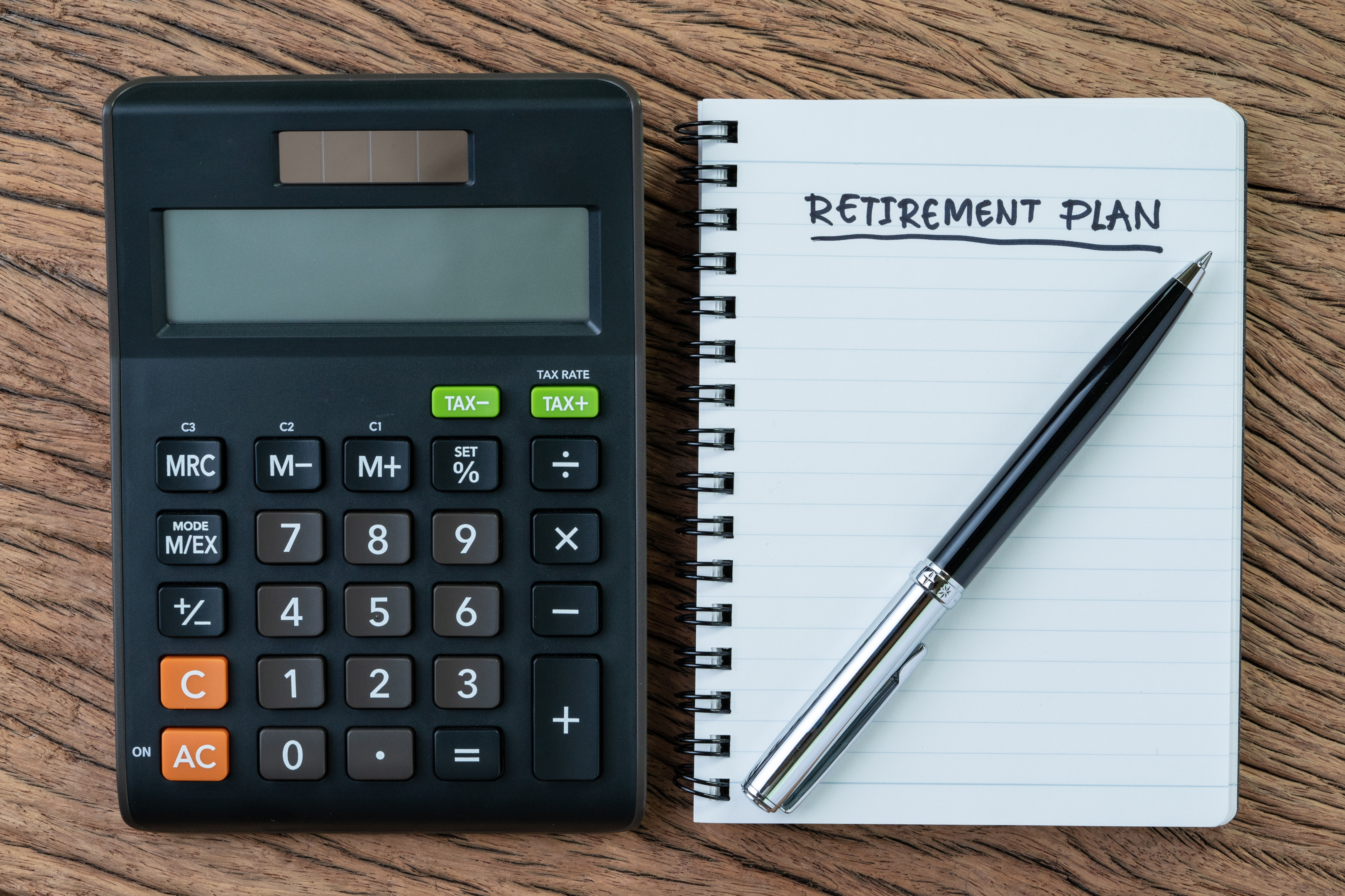 calculator and retirement plan notebook
