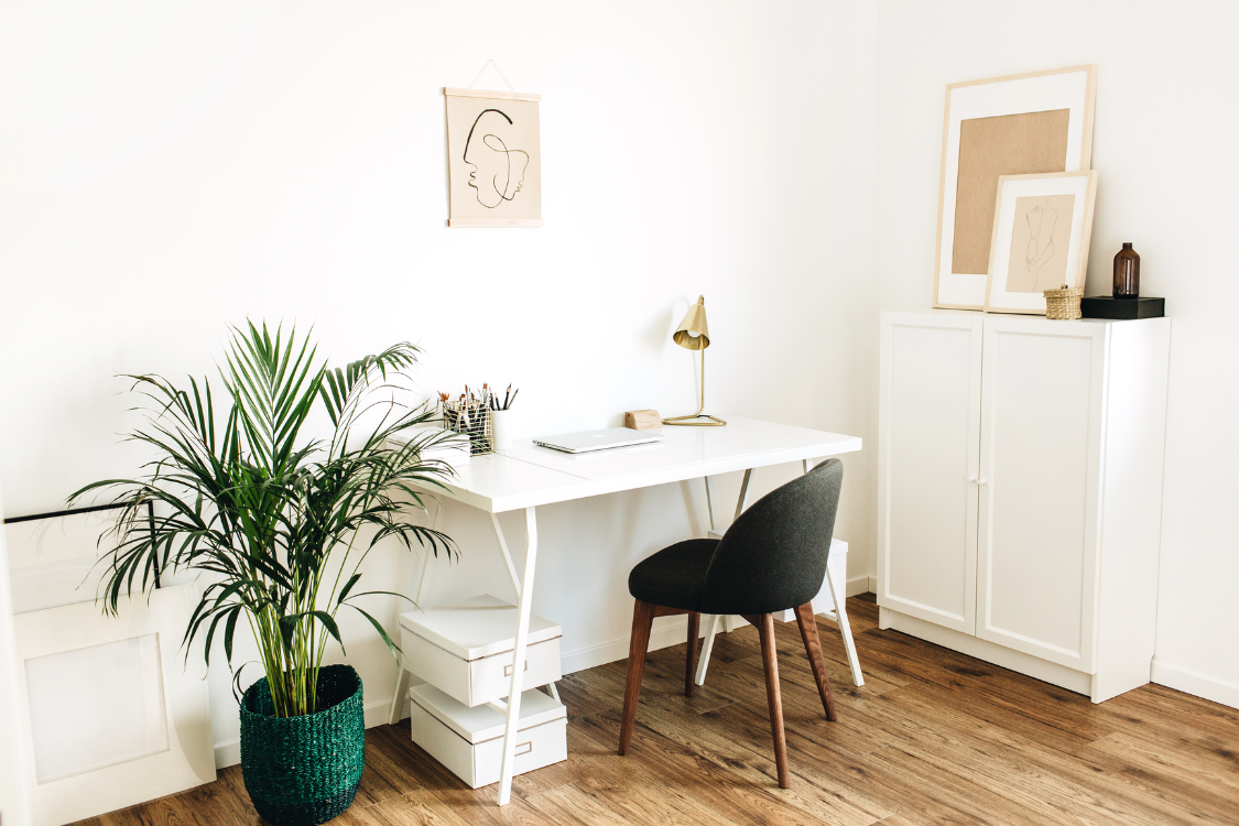 Dedicated home office workspace with natural decor and laptop for remote jobs.