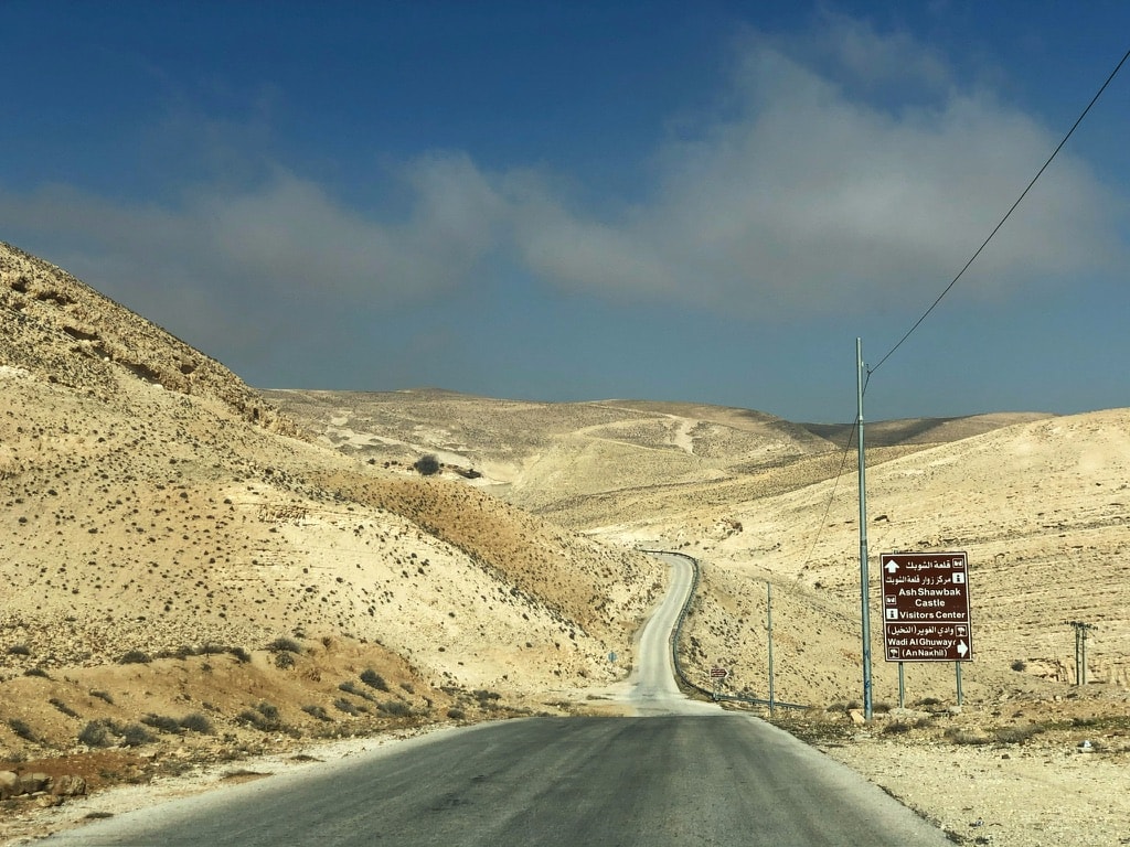 A view of the desert landscape while driving to Shobak Castle in Jordan