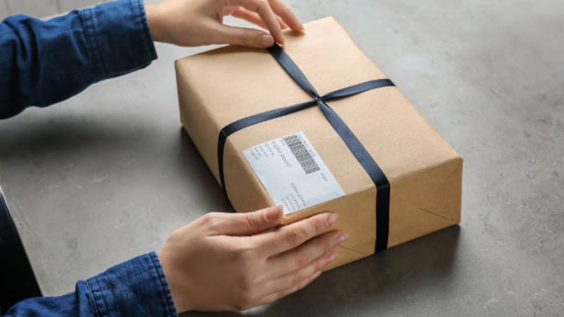 A man packaging a box