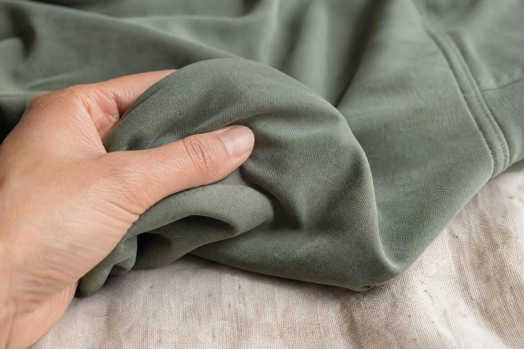 feeling the tencel lyocell material with a hand