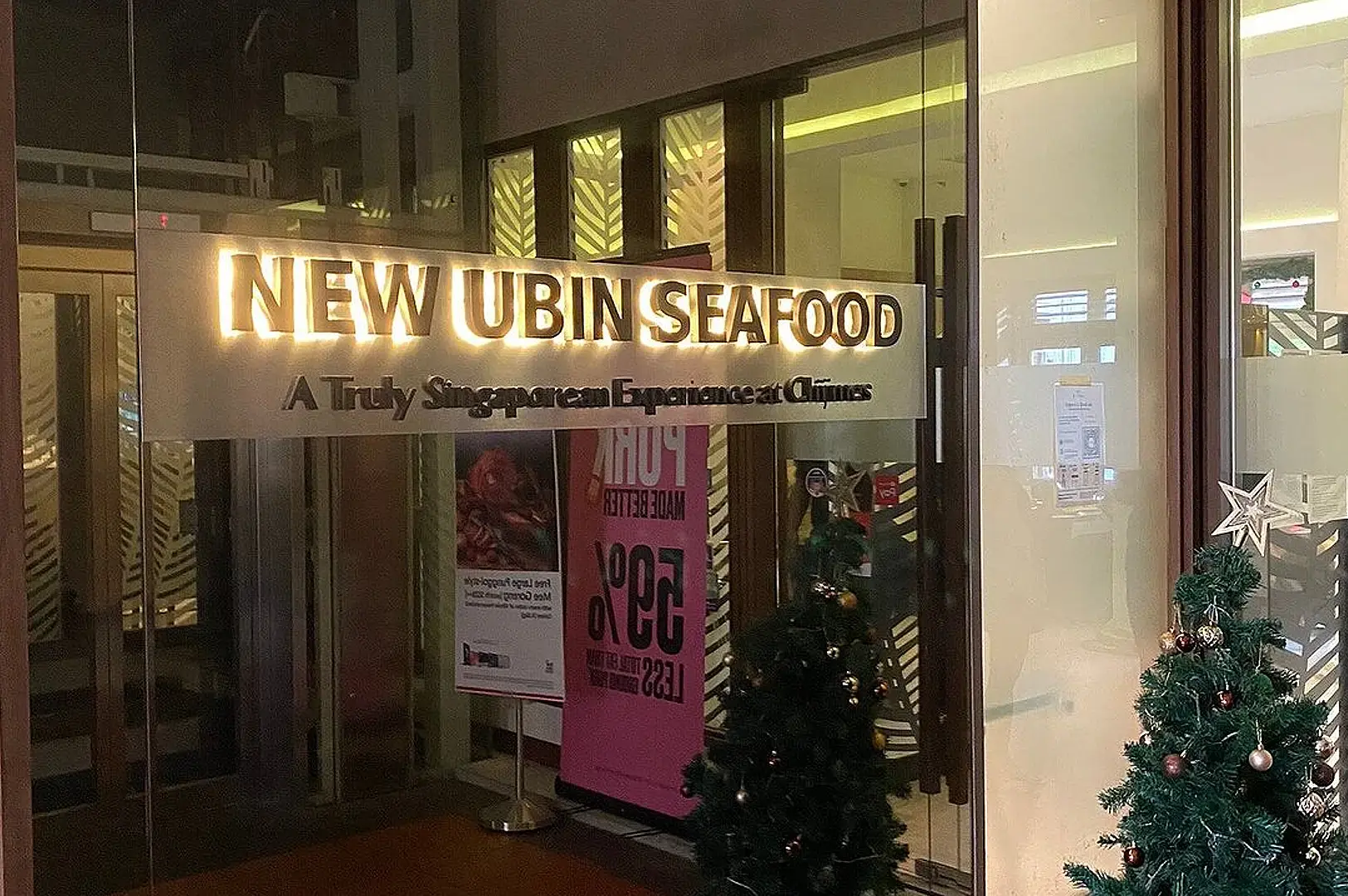 New Ubin Seafood Singapore restaurant entrance with illuminated sign