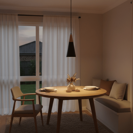 Black cone-shaped pendant light hanging above a round dining table.
