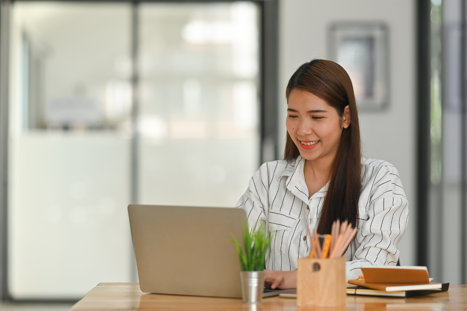 A remote employee working on her laptop.