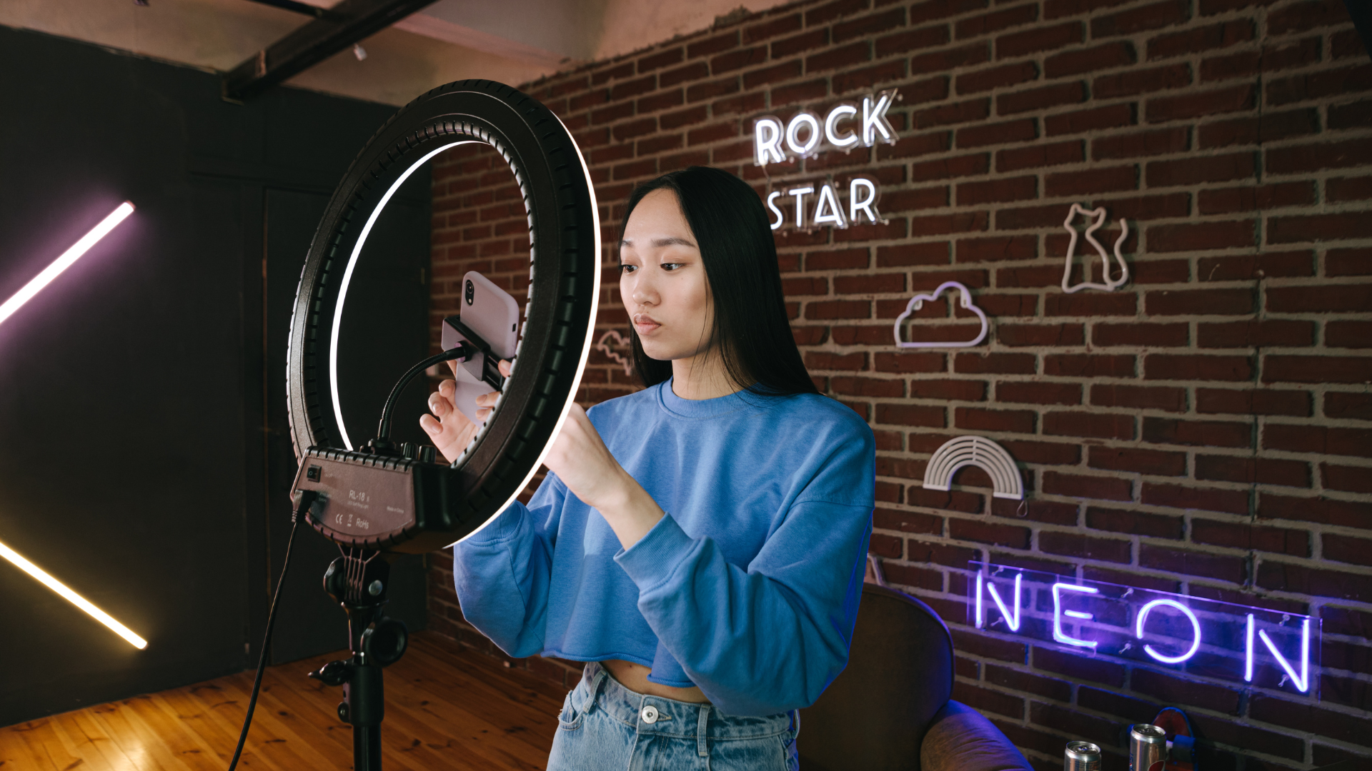 woman in front a ring light