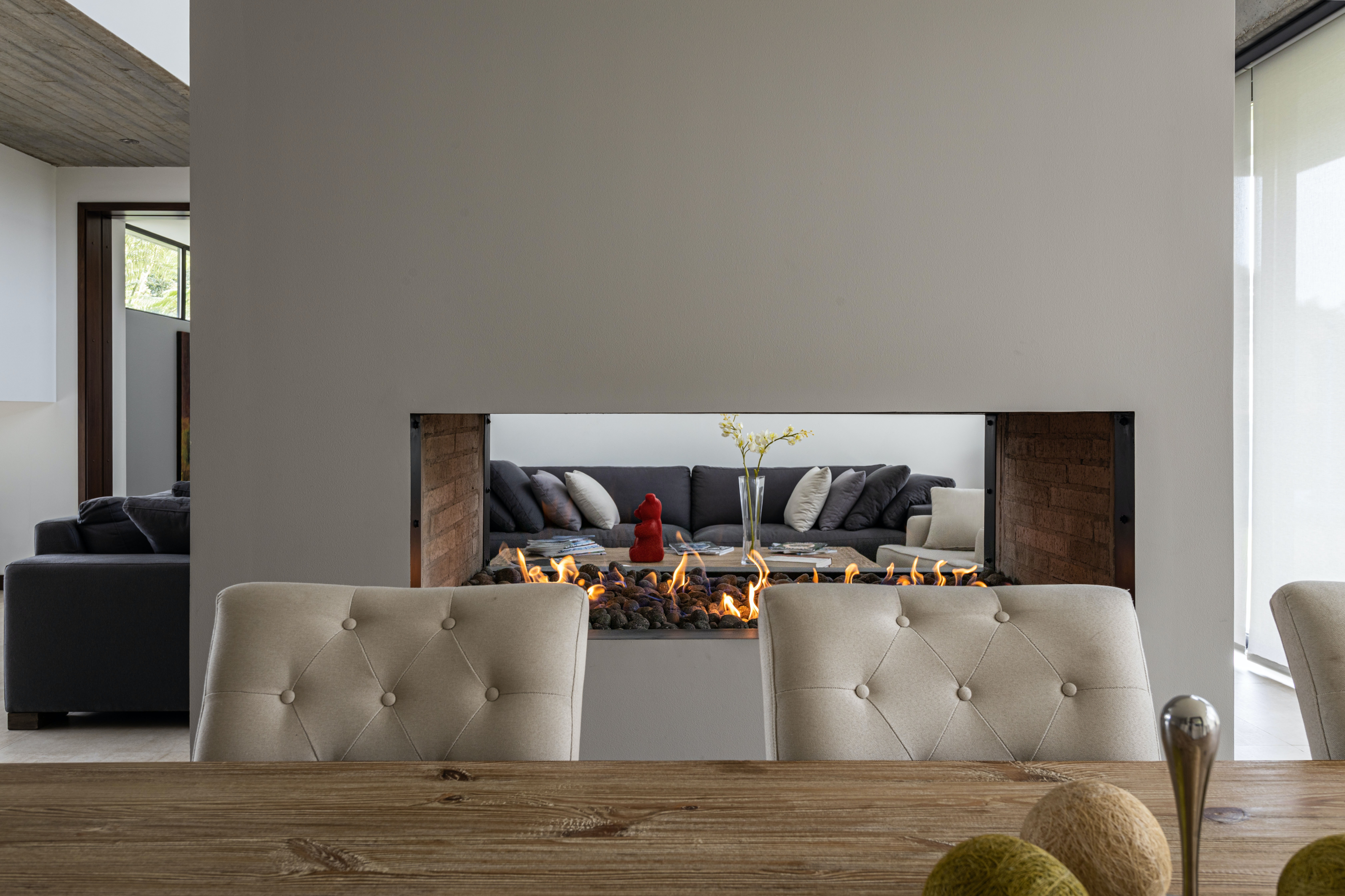 Photo by Gustavo Galeano Maz: https://www.pexels.com/photo/fireplace-between-a-living-room-and-a-dining-room-12951091/