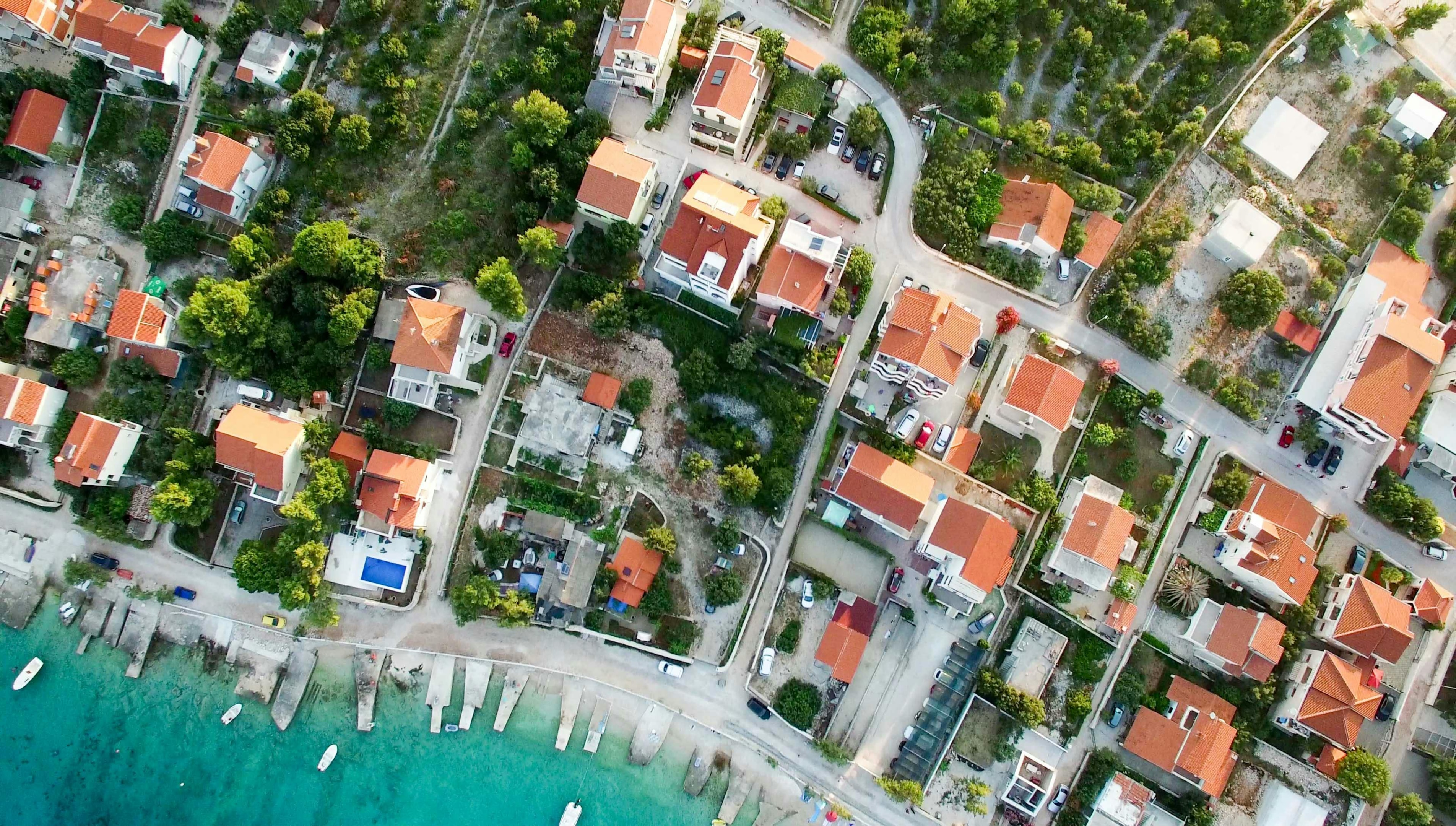 Aerial view of residential neighborhood with some houses in probate.