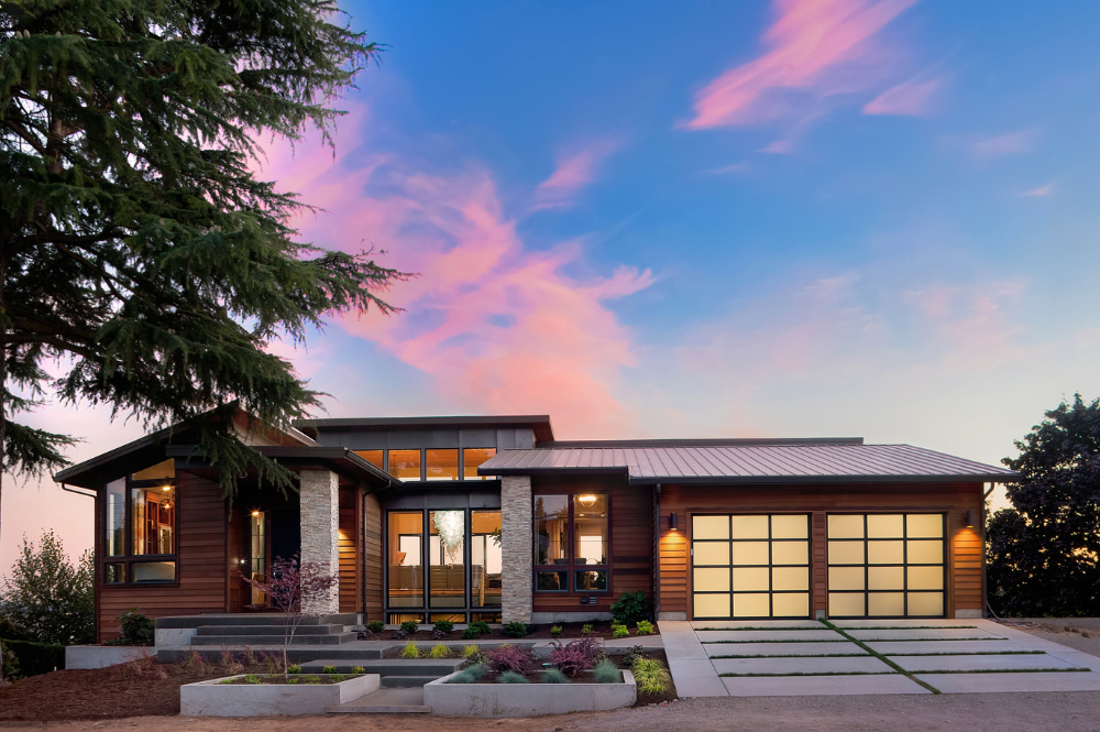 Modern home in Granite Bay featuring a large garage and expansive windows, showcasing contemporary architectural design.