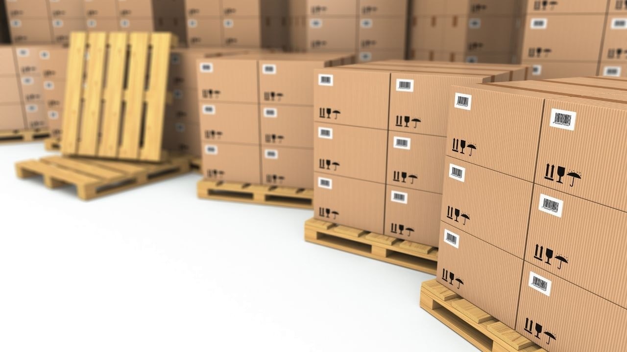 Close-up view of pallet storage with stacked cardboard boxes on wooden pallets, showcasing efficient packaging and warehouse logistics