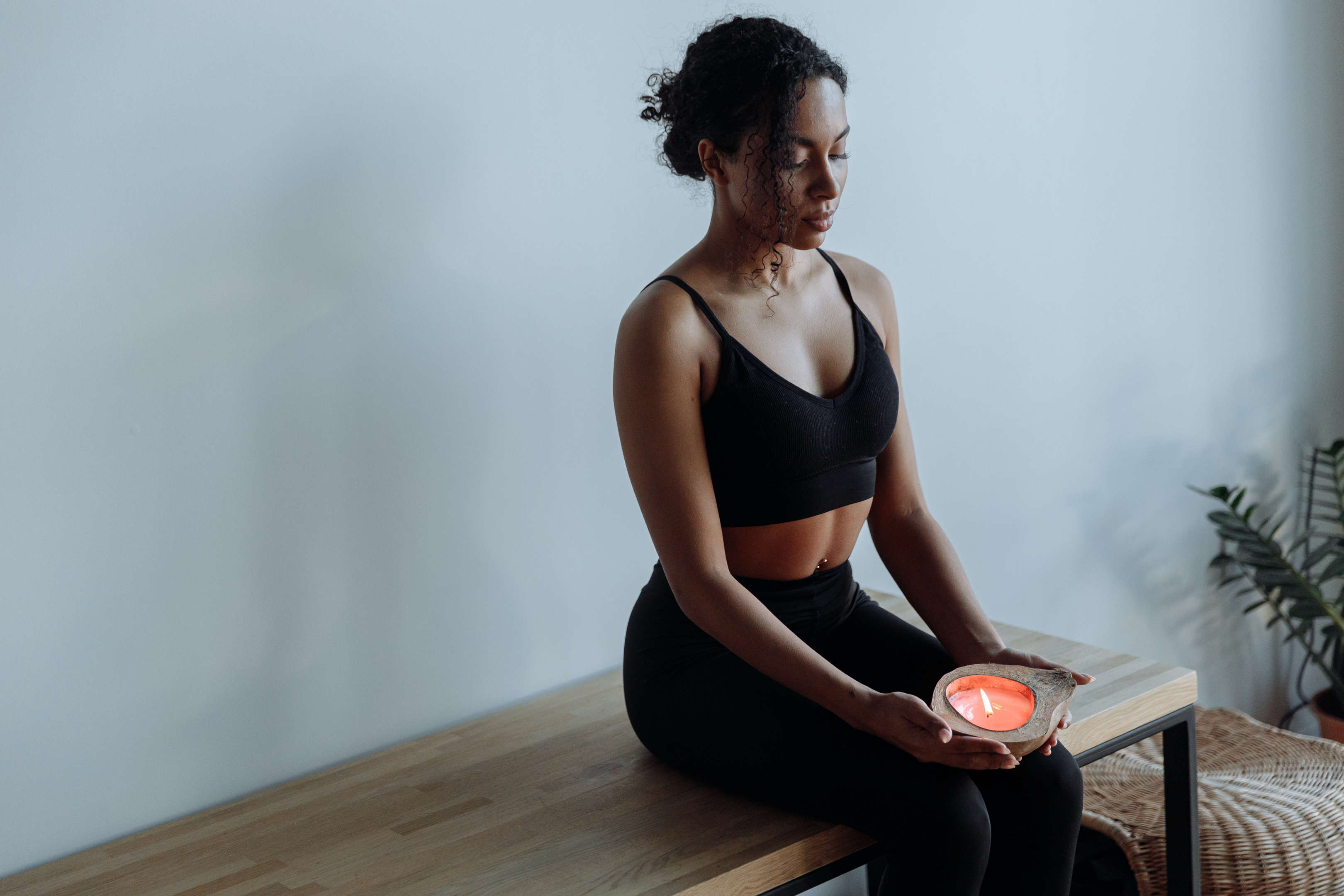 A woman meditating to calm anxiety