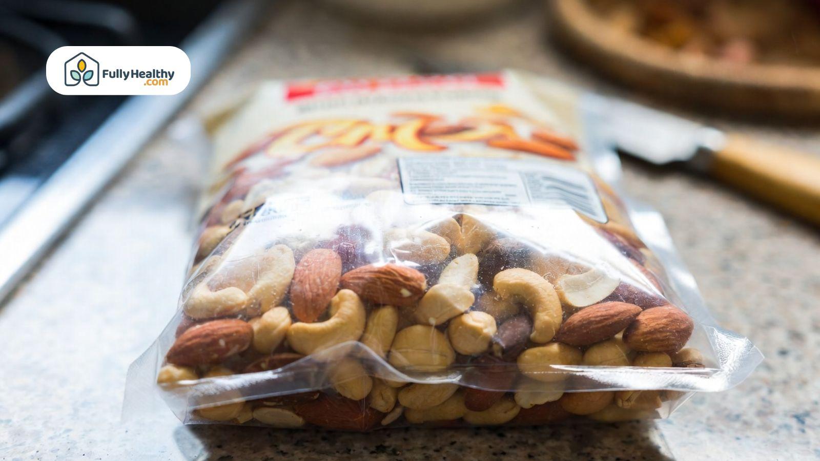 Sealed plastic bag of mixed nuts placed on a kitchen countertop with visible packaging.