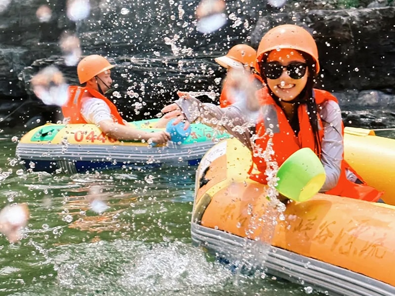 People engaging in various water activities while wearing life jackets.