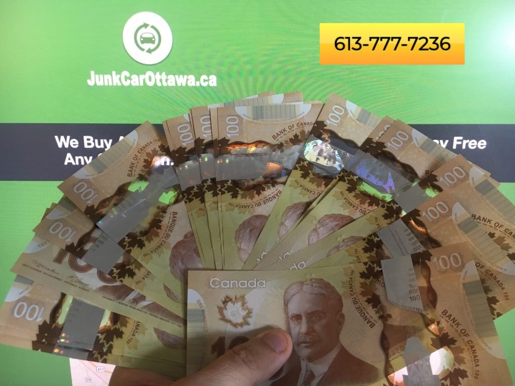 Junk Car removal Ottawa web page with cash being held in front of it.