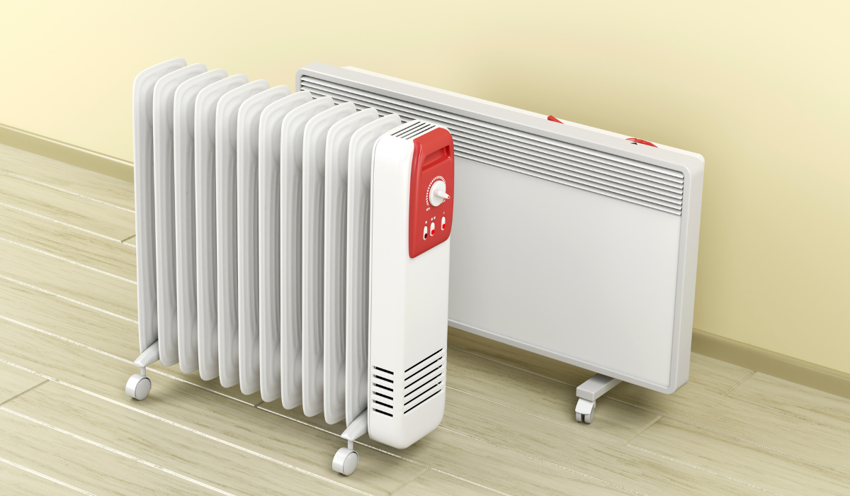 Portable electric heaters - an oil-filled radiator with a convector heater on a hardwood floor