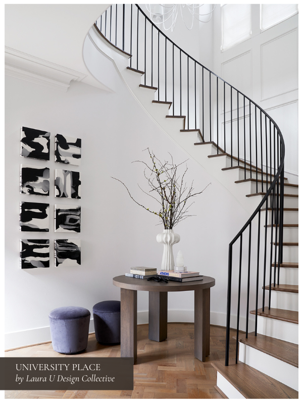 a black and white entryway vignette with purple stools