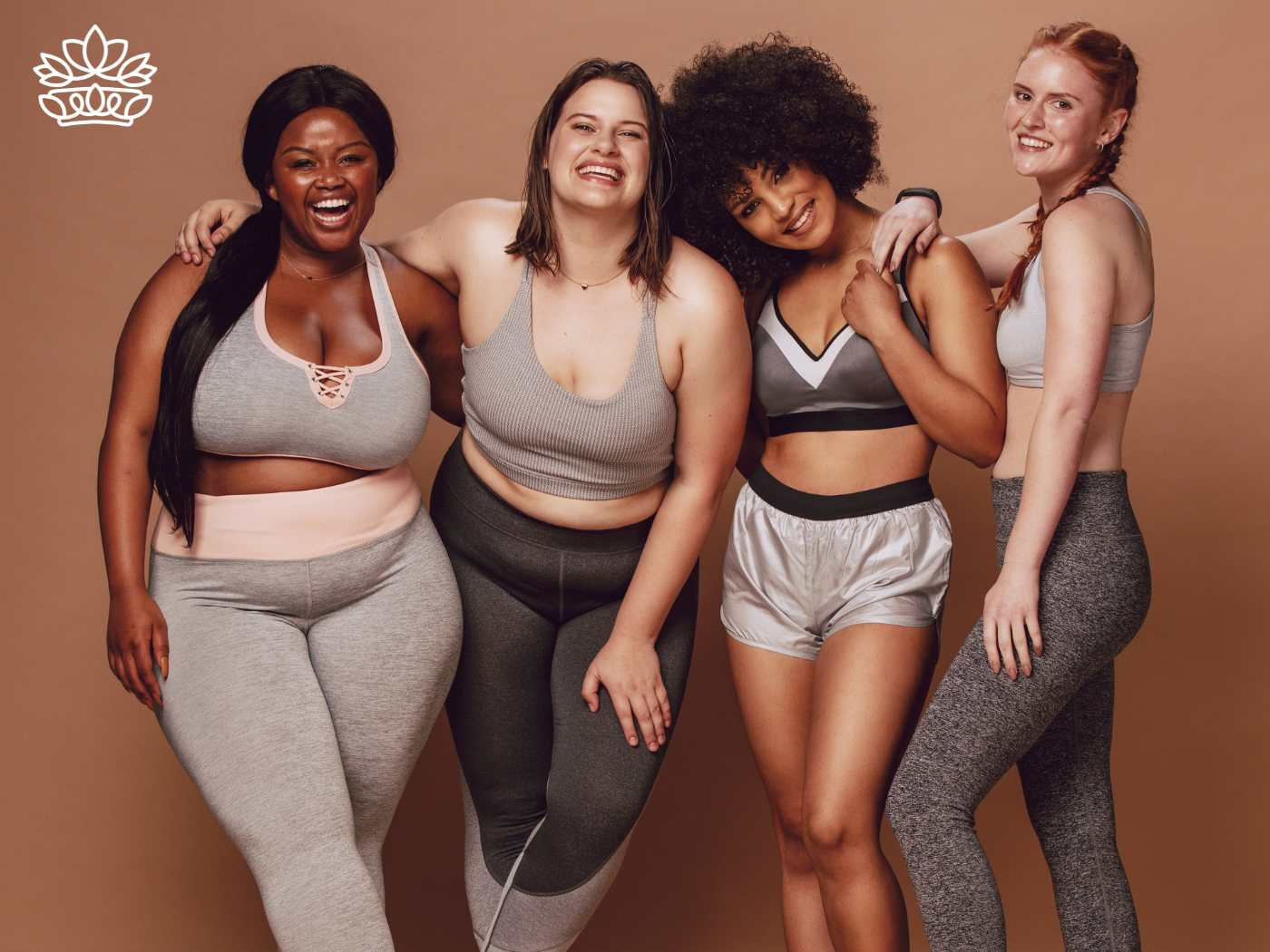 Four happy women of different body types and ethnicities, posing confidently in stylish athletic wear. Perfect for moms searching for a beautiful gift that has everyone covered, from the Gifts Boxes for Women Collection. Fabulous Flowers and Gifts.