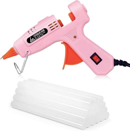 Pink mini glue gun with a pack of hot glue sticks