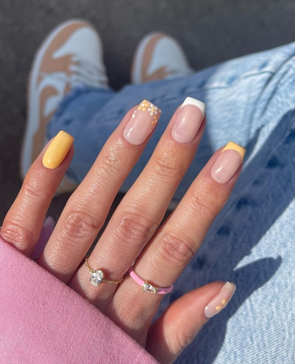 Yellow summer nails with french tips and flowers