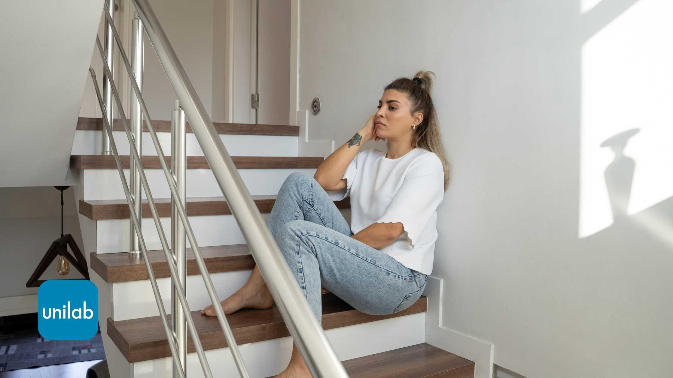 A women upset on a staircase