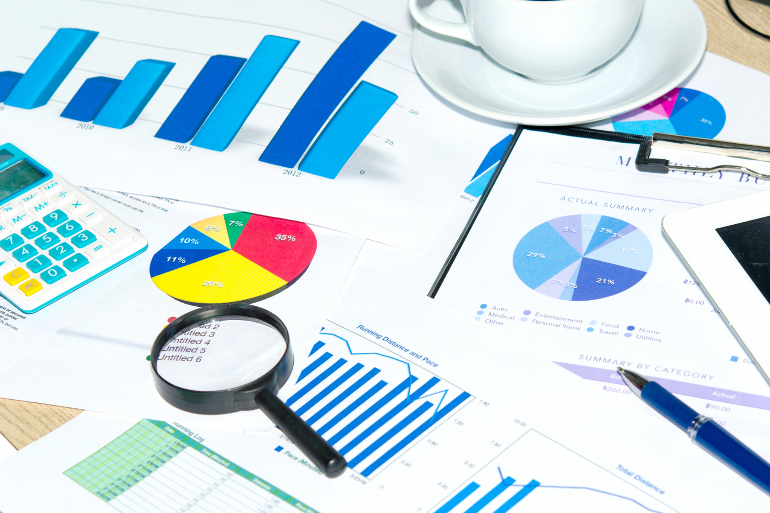 Documents with pie charts and bar graphs.