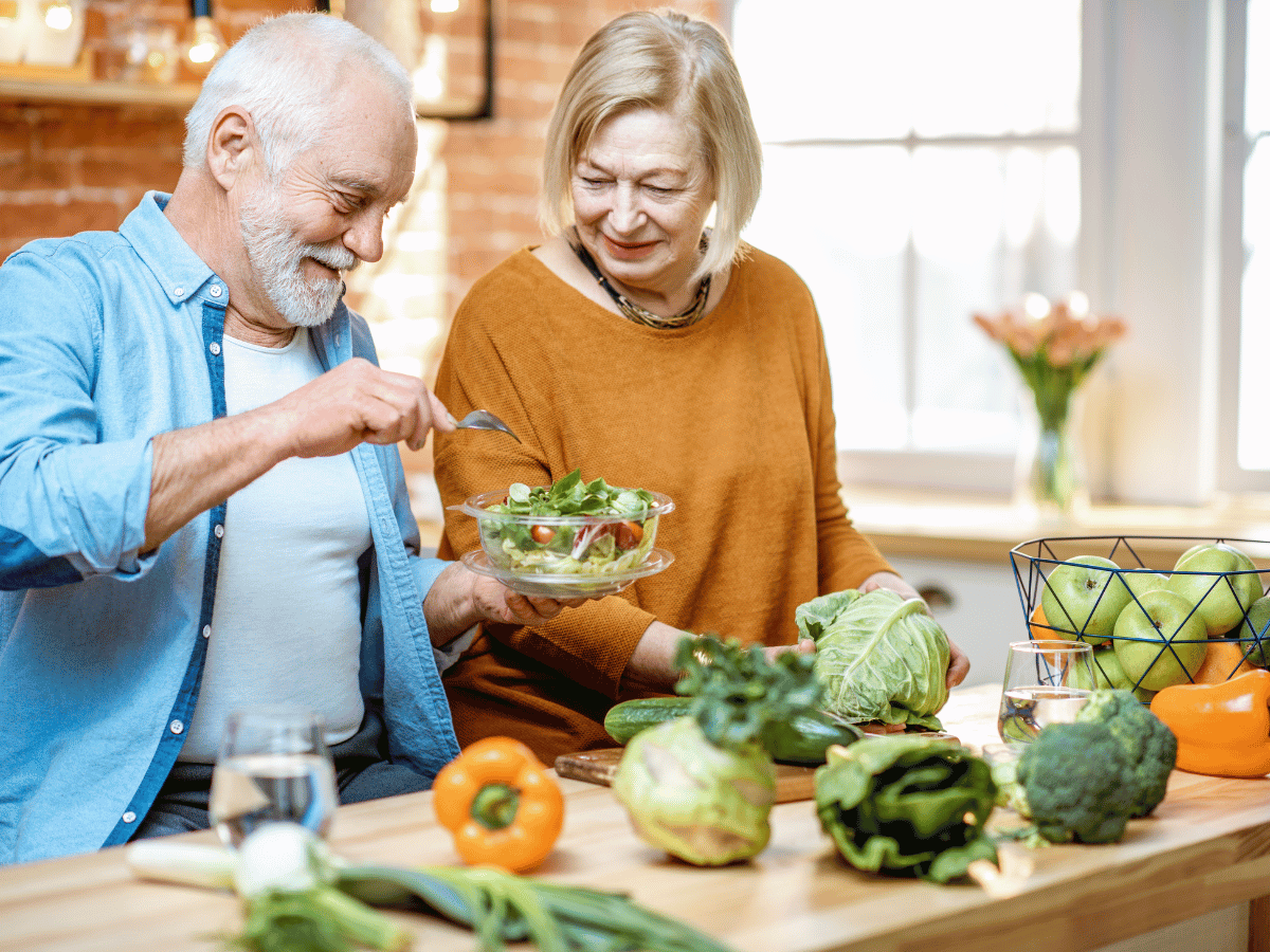 senior male enjoying his food with a stable dental implant