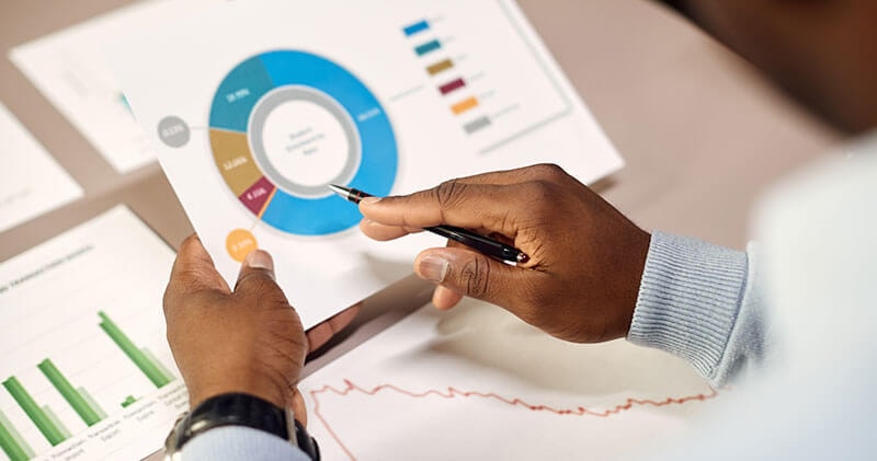 Businessman reviewing analytics data illustrating missed feedback loops in gathering insights and analysis.
