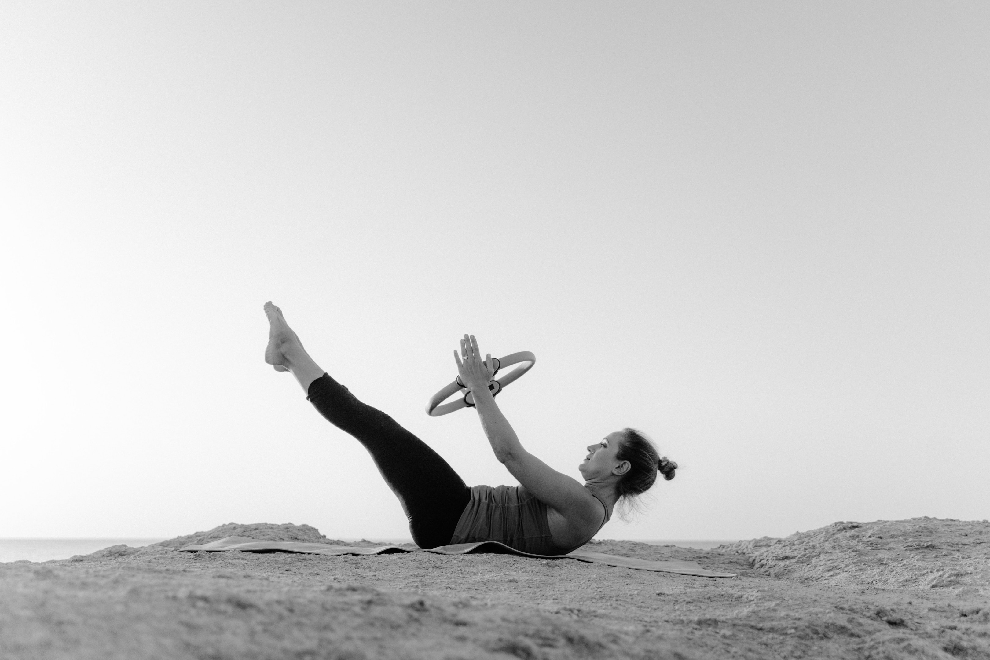 Photo by Tima Miroshnichenko: https://www.pexels.com/photo/grayscale-photo-of-woman-using-pilates-ring-5929006/