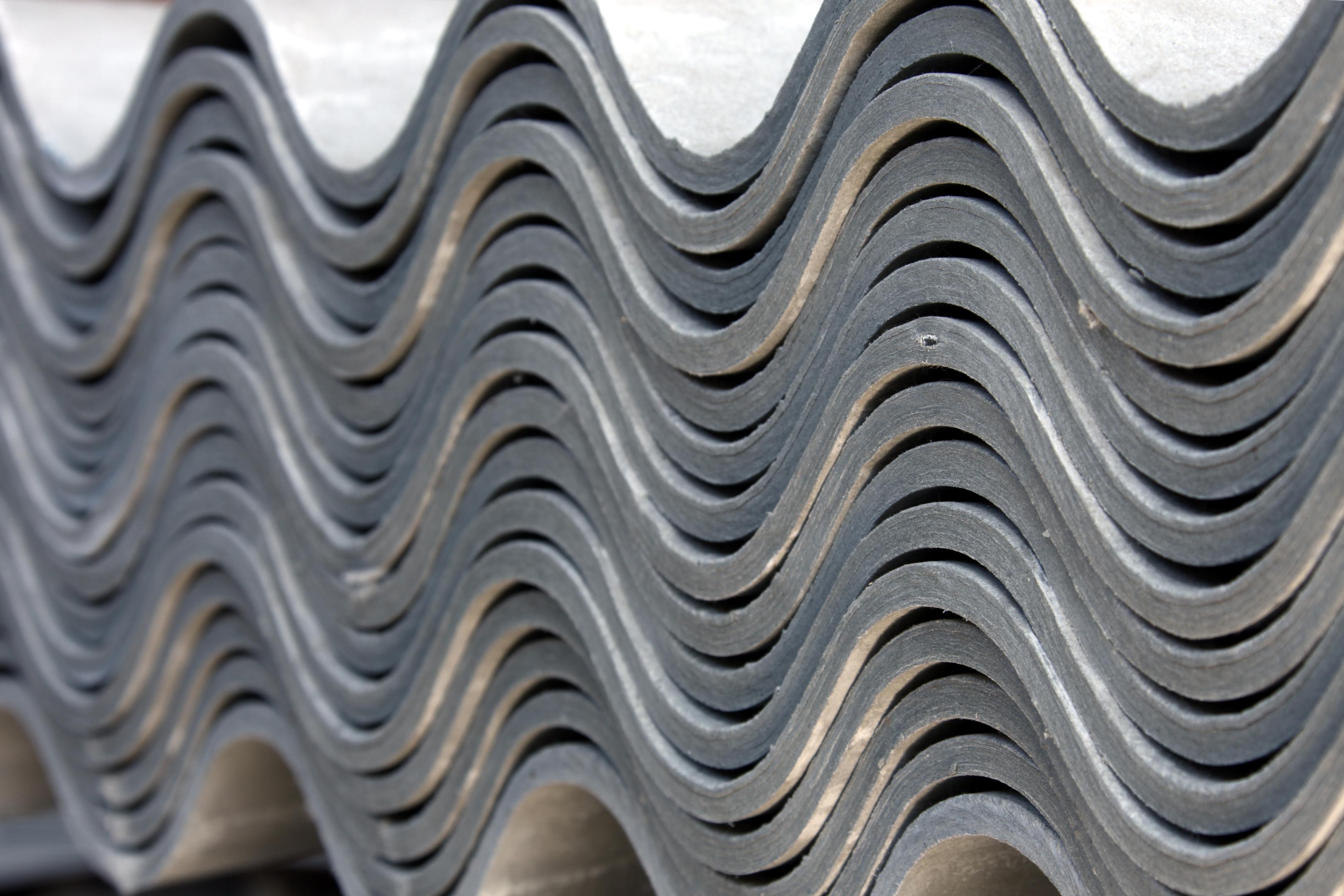 Corrugated Asbestos Sheets Piled High, Building Materials