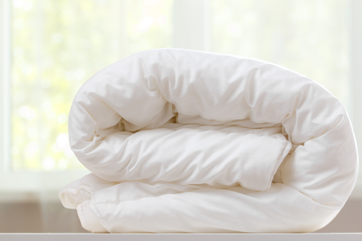 Illustration of the burrito method for putting on a duvet cover