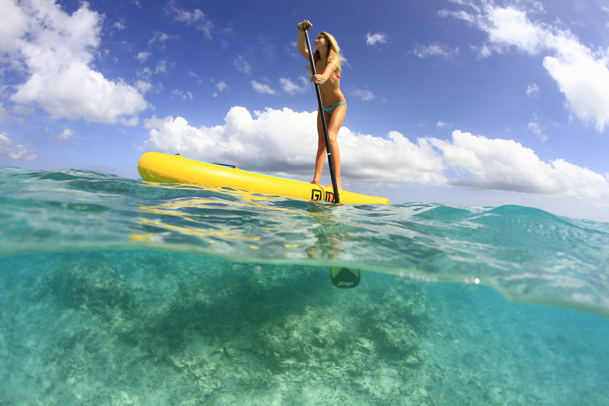 woman on inflatable stand up paddle board